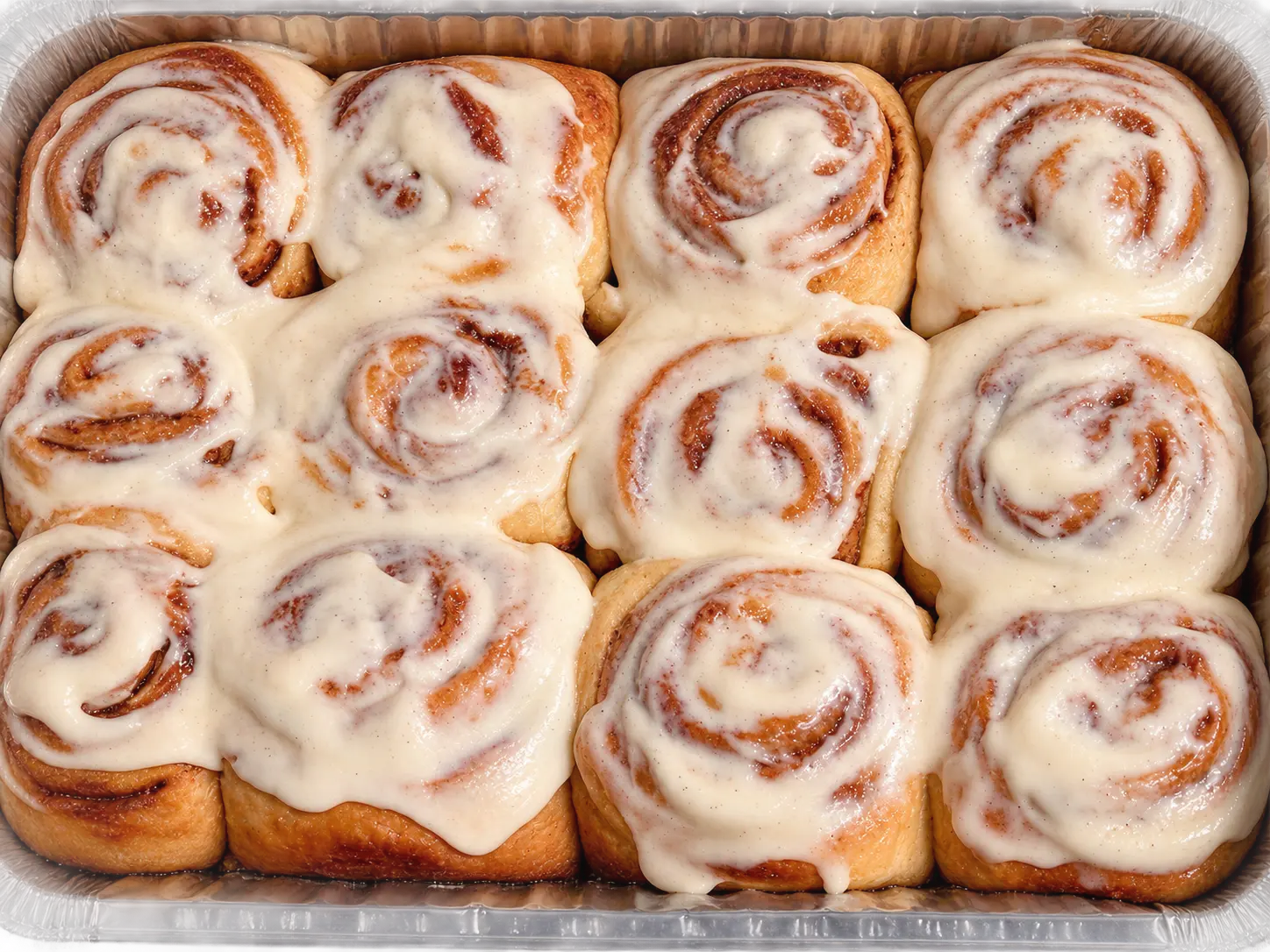 A full pan of vanilla bean cinnamon rolls from Between Naps Bakery
